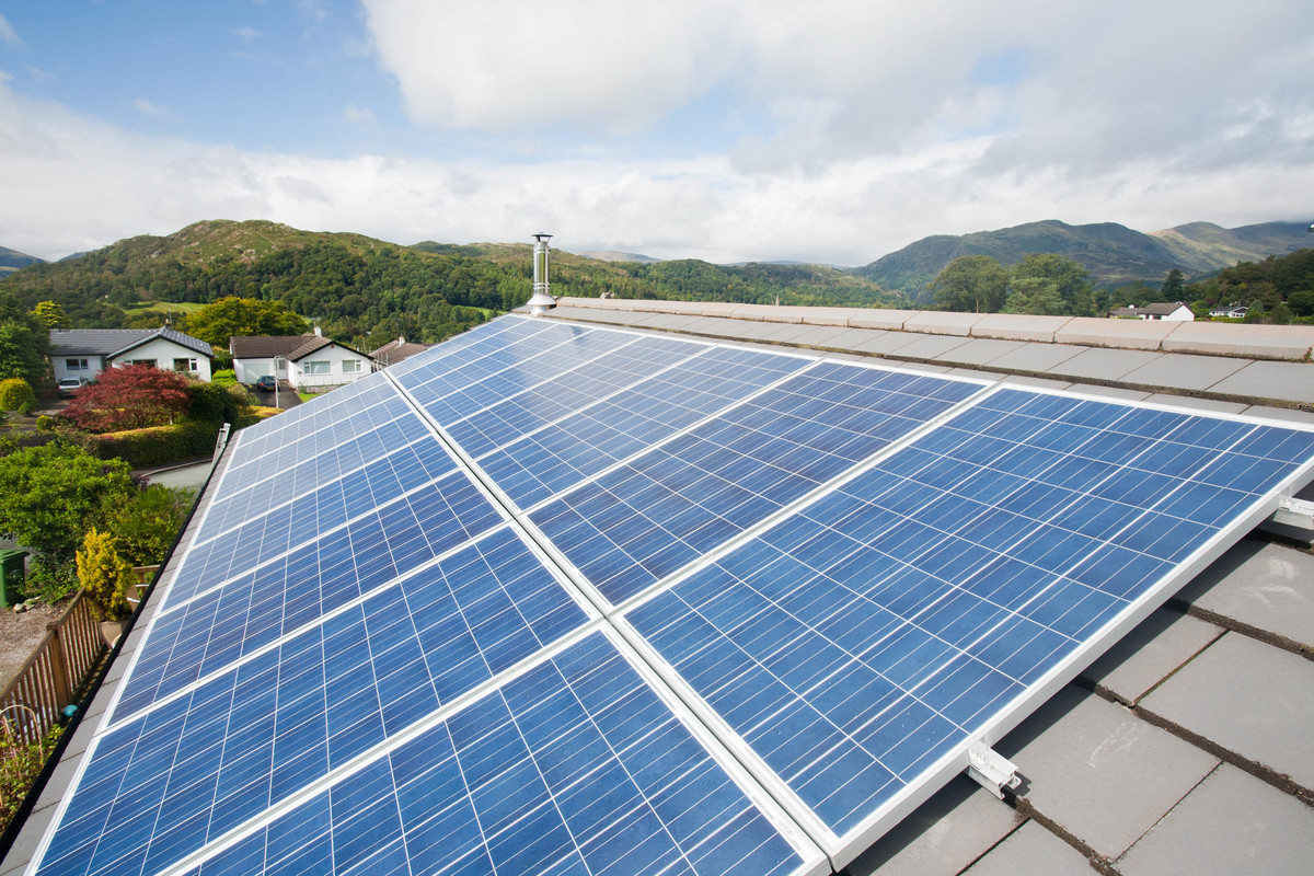 Solar voltaic panels on a house roof in Ambleside, Cumbria, UK.